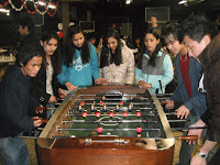 RYAN mentors and refugee young adults gathered together at a community event.